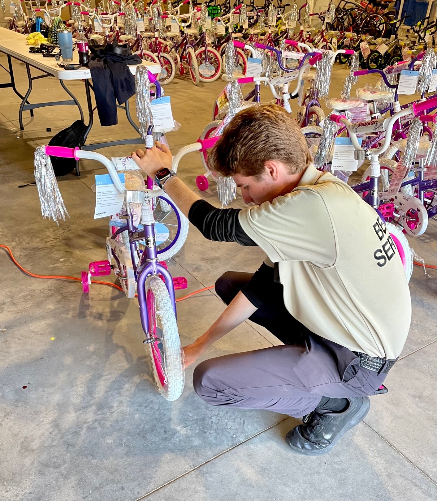 BSO Livingston assembling bikes for Toys for Tots.